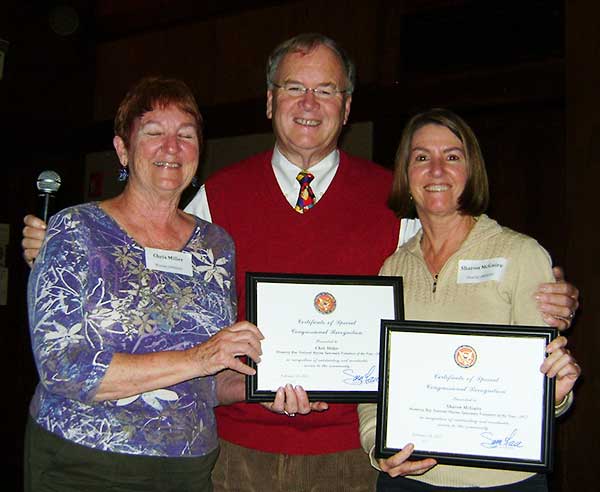 Chris Miller and Sharon McGuire receiving award