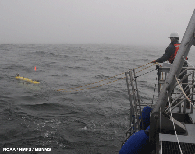 image of AUV being deployed from the R/V Fulmar at outer Carmel Canyon.