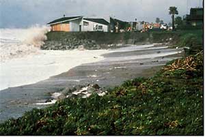ocean front home being hit by wave